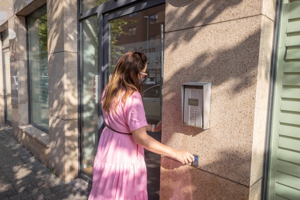 A lady entering a building